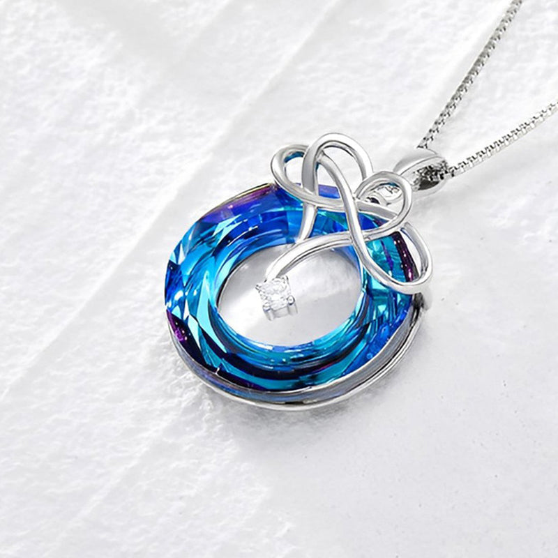 Ensemble de collier et de boucles d'oreilles en cristal d'amour infini